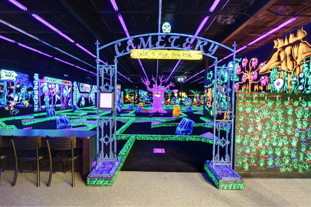 Entrance to a Monster Mini Golf's glow-in-the-dark indoor mini golf course.