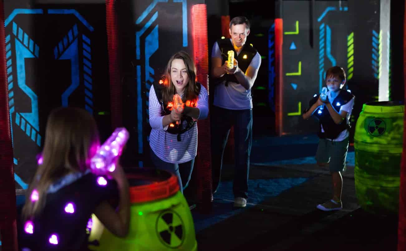 family playing laser tag