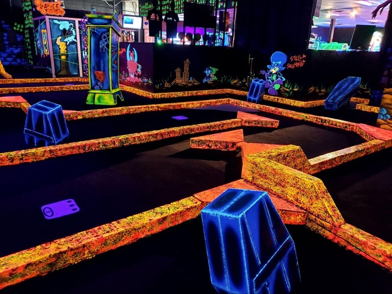 A glow-in-the dark golf course at Monster Mini Golf. 