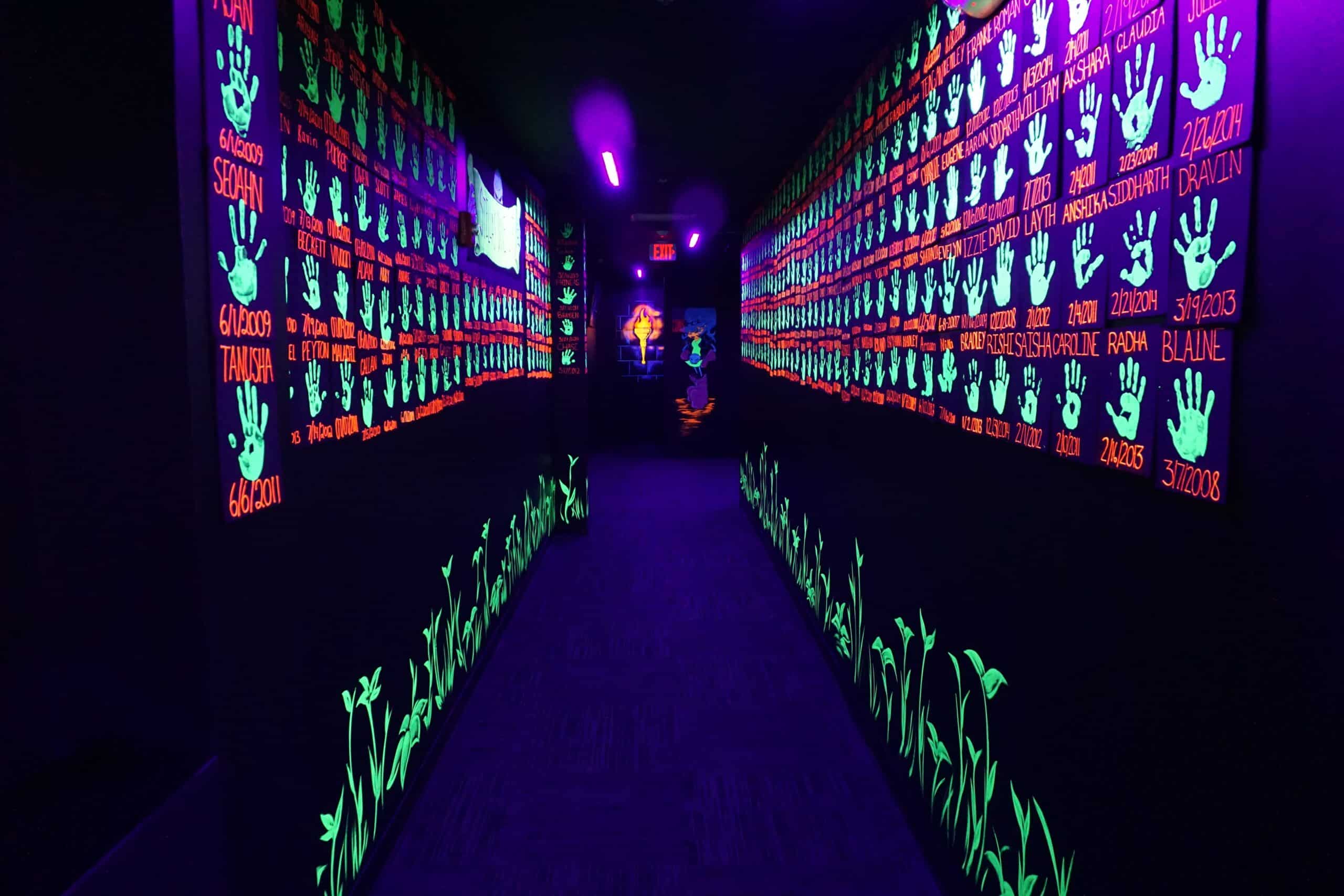hallway with glow-in-the-dark hand prints