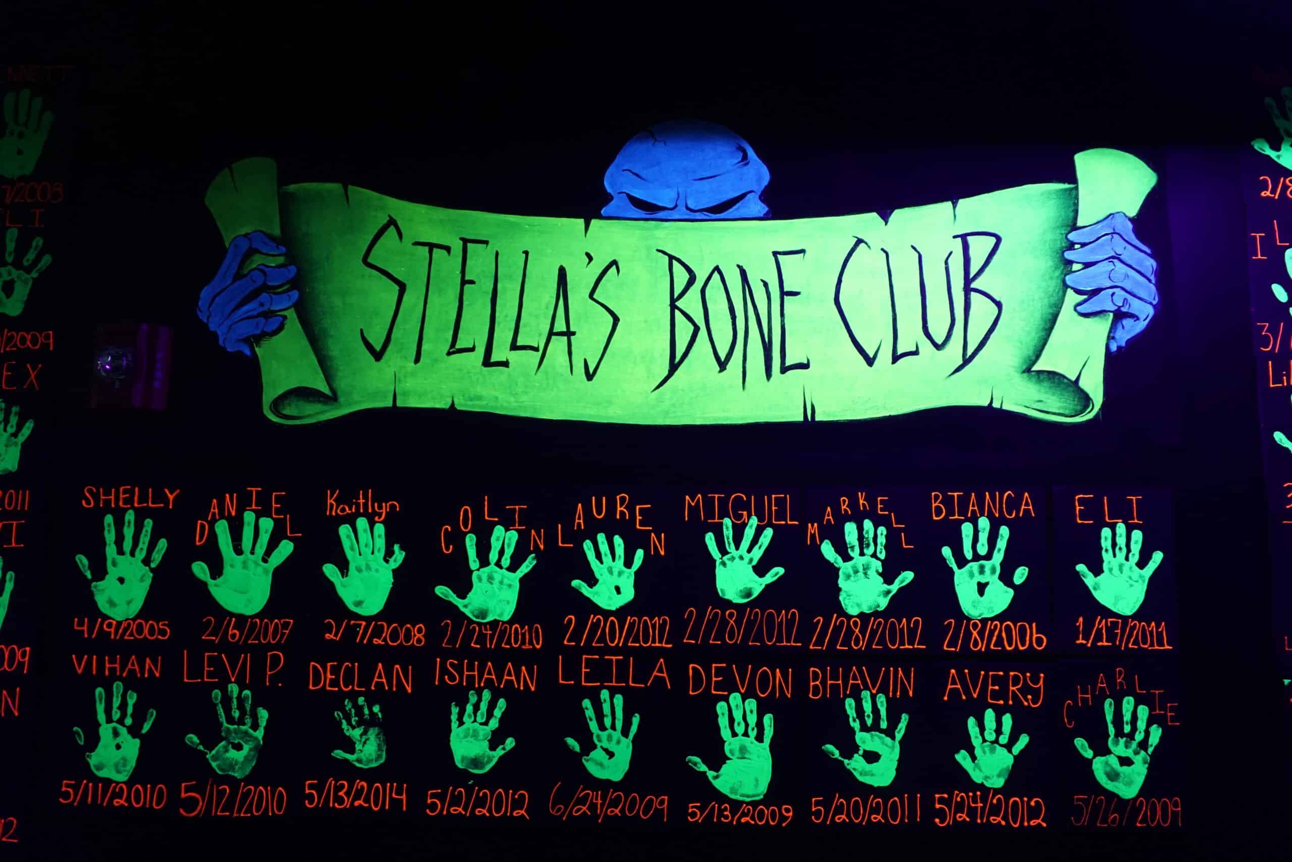 stella's bone club, a group event, with hand prints below