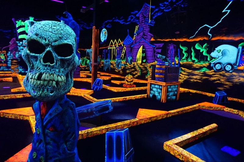 A glow-in-the-dark indoor golf course at Monster Mini Golf. 