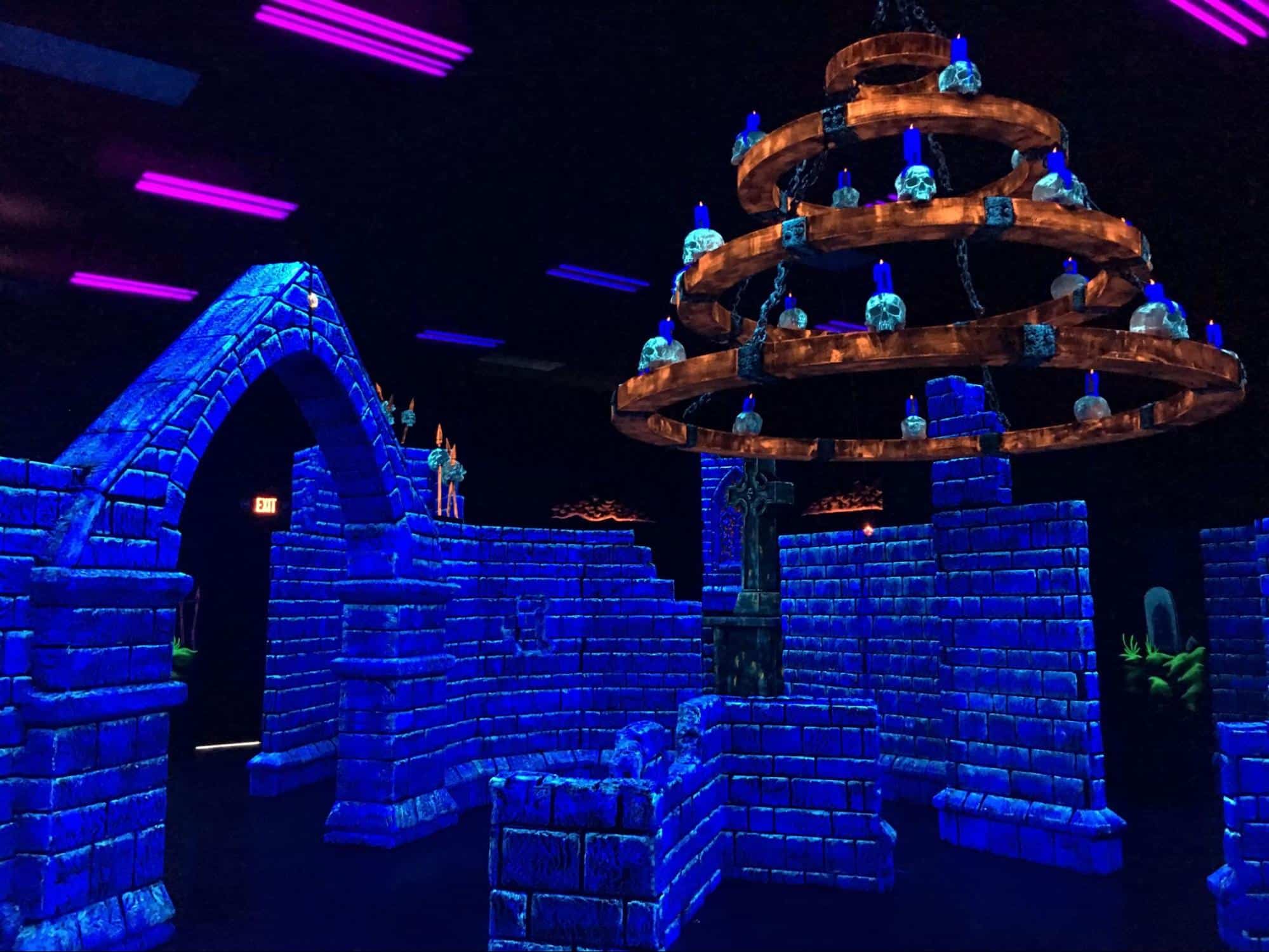 A glow-in-the-dark laser tag arena at Monster Mini Golf. 