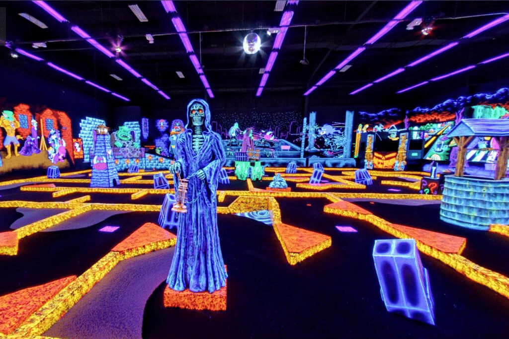 A neon, glow-in-the-dark indoor mini golf course at Monster Mini Golf.