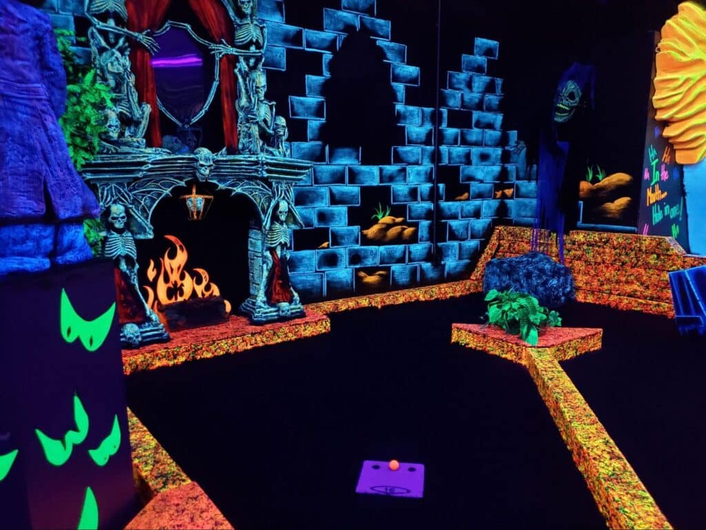 An indoor mini golf course that is glow-in-the-dark at Monster Mini Golf.