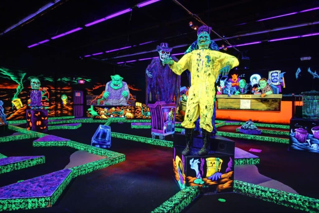 A glow-in-the-dark indoor mini golf course at Monster Mini Golf.