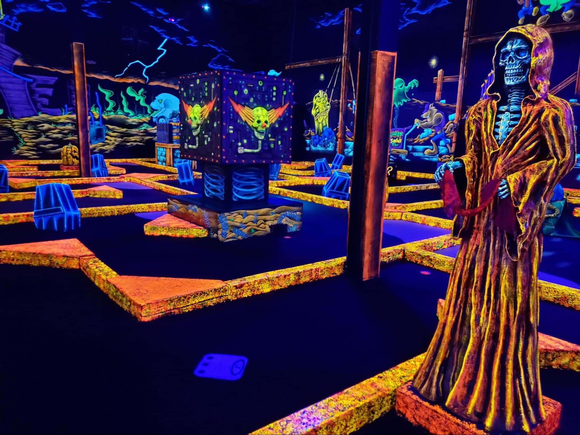 A glow-in-the-dark mini golf course at monster mini golf.