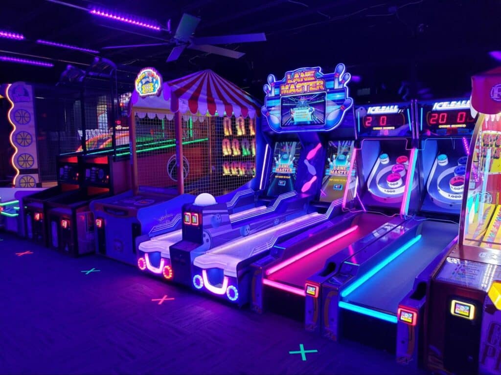 A row of arcade games at Monster Mini Golf.