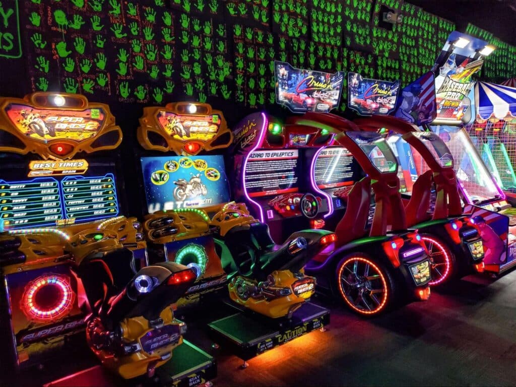 A row of arcade games at Monster Mini Golf.