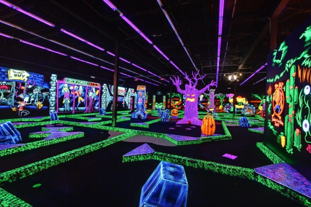 A glow-in-the-dark mini golf course at Monster Mini Golf.