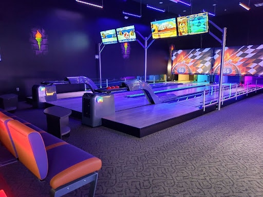 Glow-in-the-dark bowling alley lanes at Monster Mini Golf.