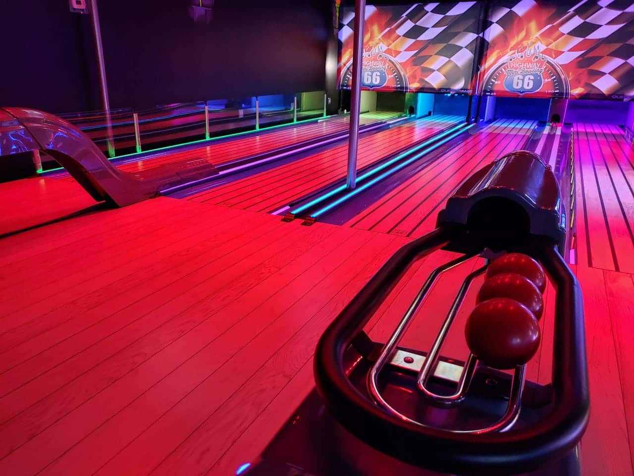 Glow-in-the-dark mini bowling lanes at Monster Mini Golf.