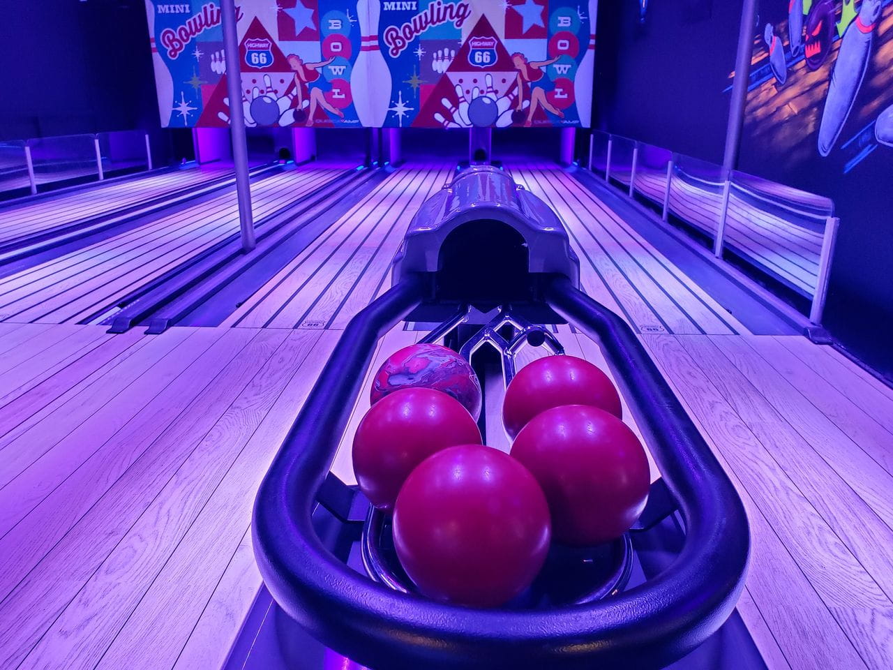 Glow-in-the-dark mini bowling lanes at monster mini golf.