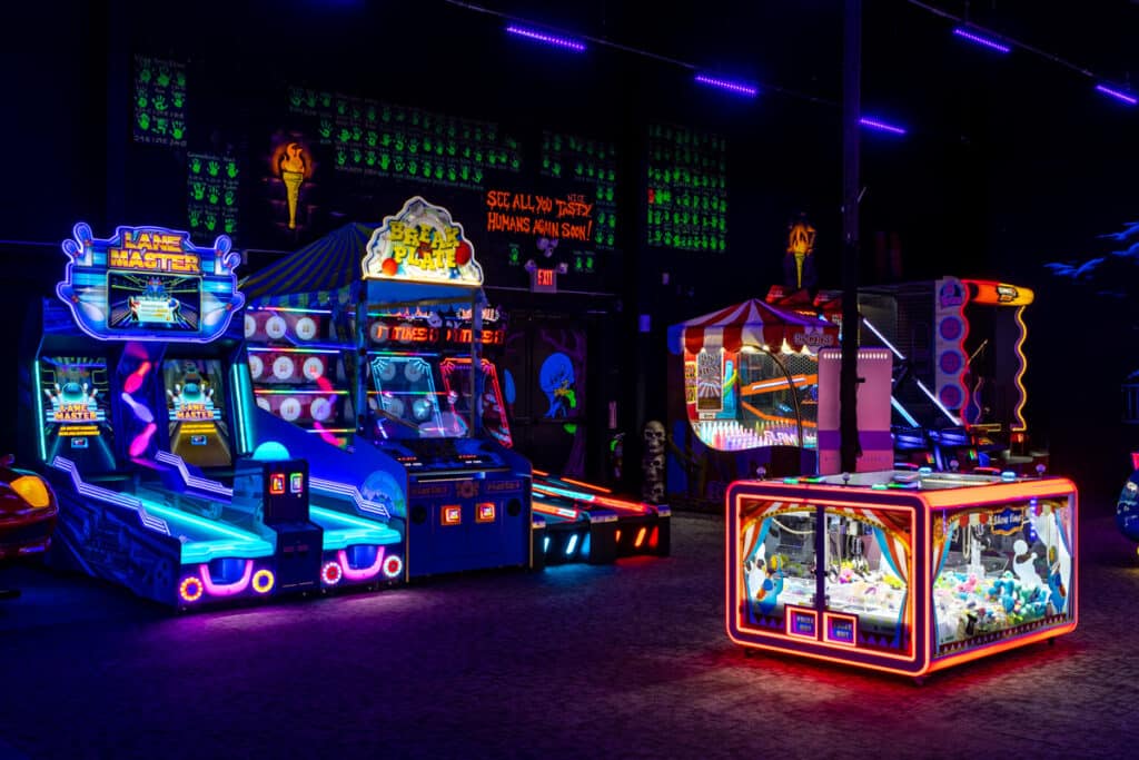 Wide view of a variety of arcade games available at Monster Mini Golf in Eatontown, New Jersey