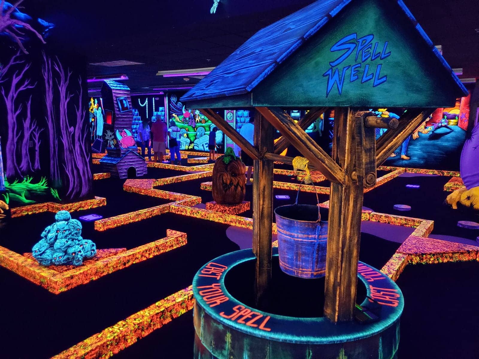 A glow-in-the-dark indoor golf course at Monster Mini Golf.