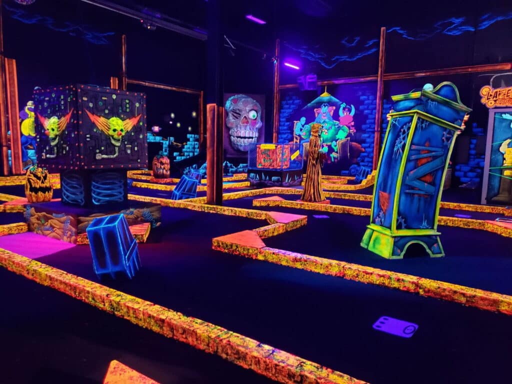 A glow-in-the-dark indoor mini golf course at Monster Mini Golf.