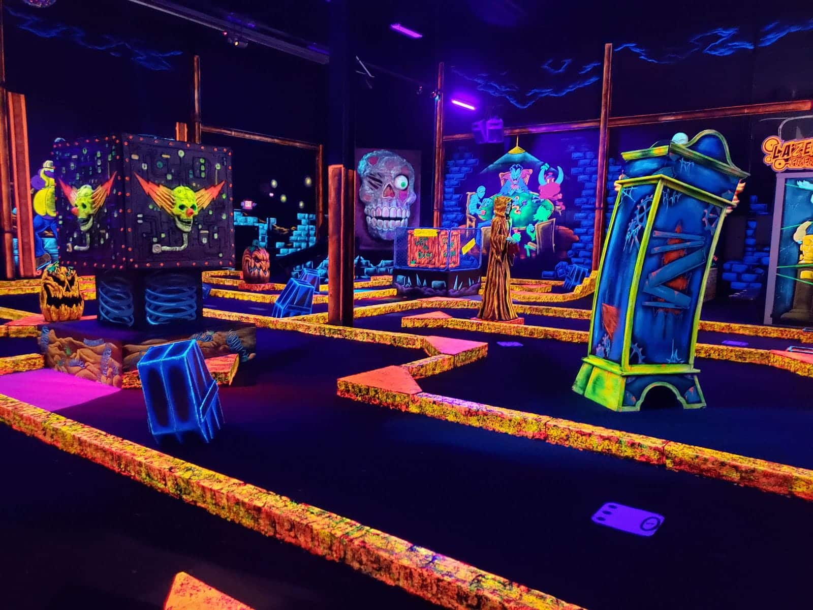 A glow-in-the-dark indoor mini golf course at monster mini golf.