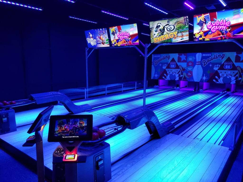 Neon mini bowling lanes at a monster mini golf location.