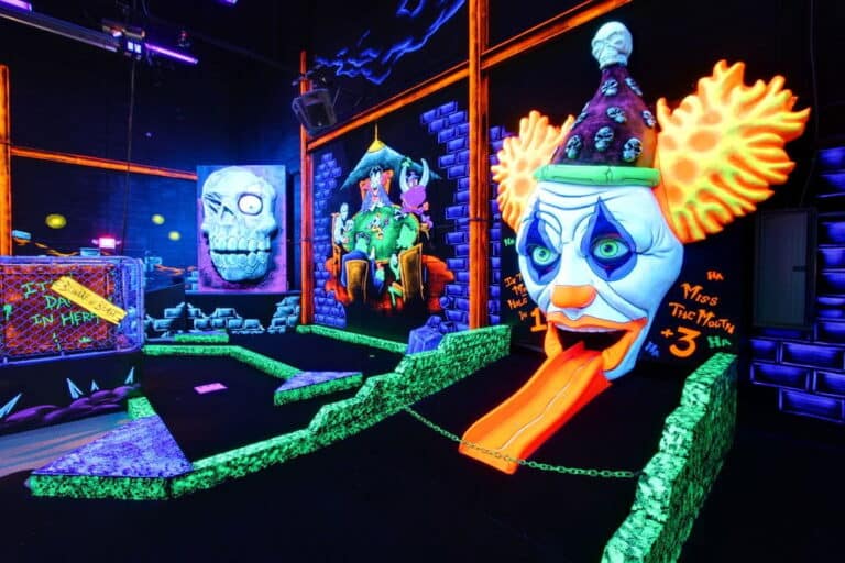 An indoor glow-in-the-dark mini golf course at monster mini golf.