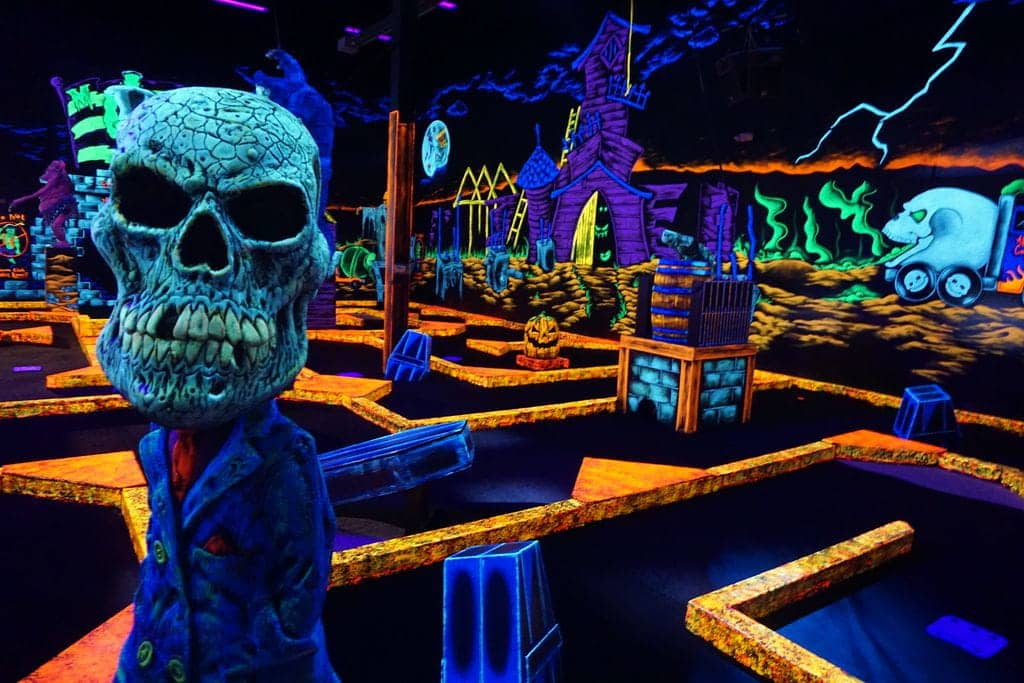 Neon decorations at the glow-in-the-dark mini golf course at a monster mini golf location.