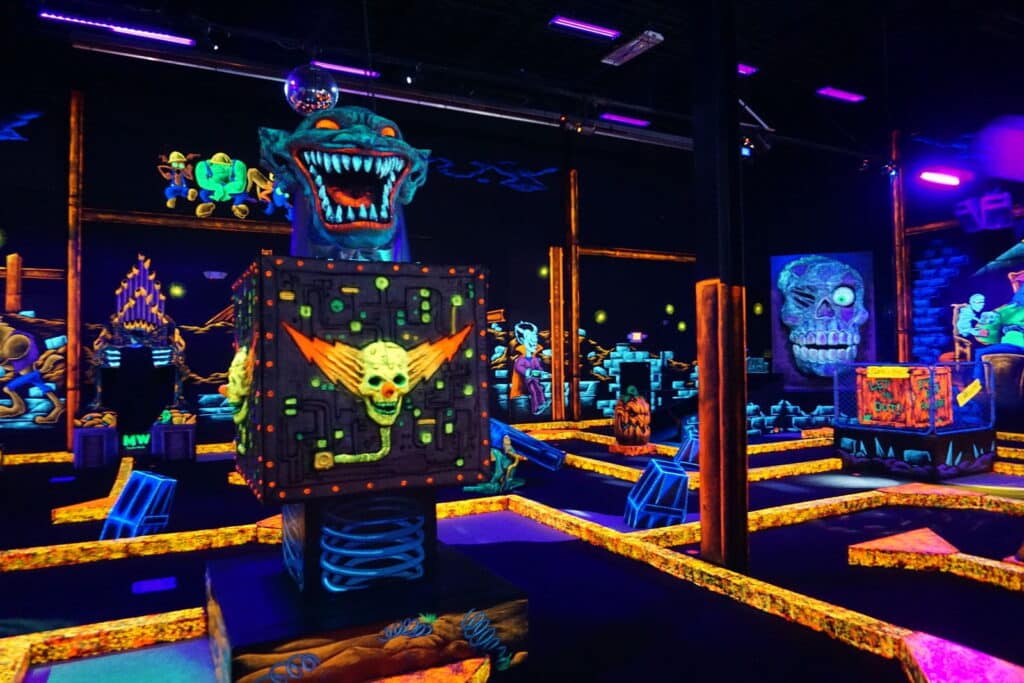 Neon decorations at a monster mini golf location.