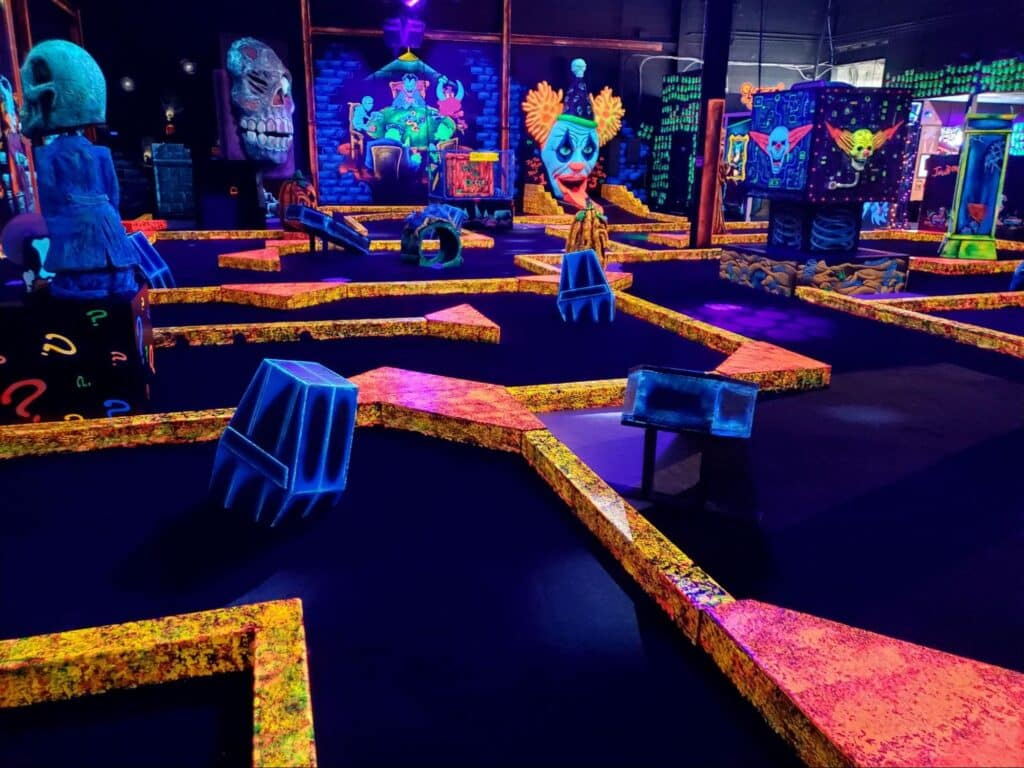 Neon decorations at a monster mini golf location.