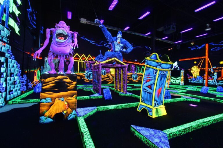 Neon monsters at an indoor mini golf course located at Monster Mini Golf.