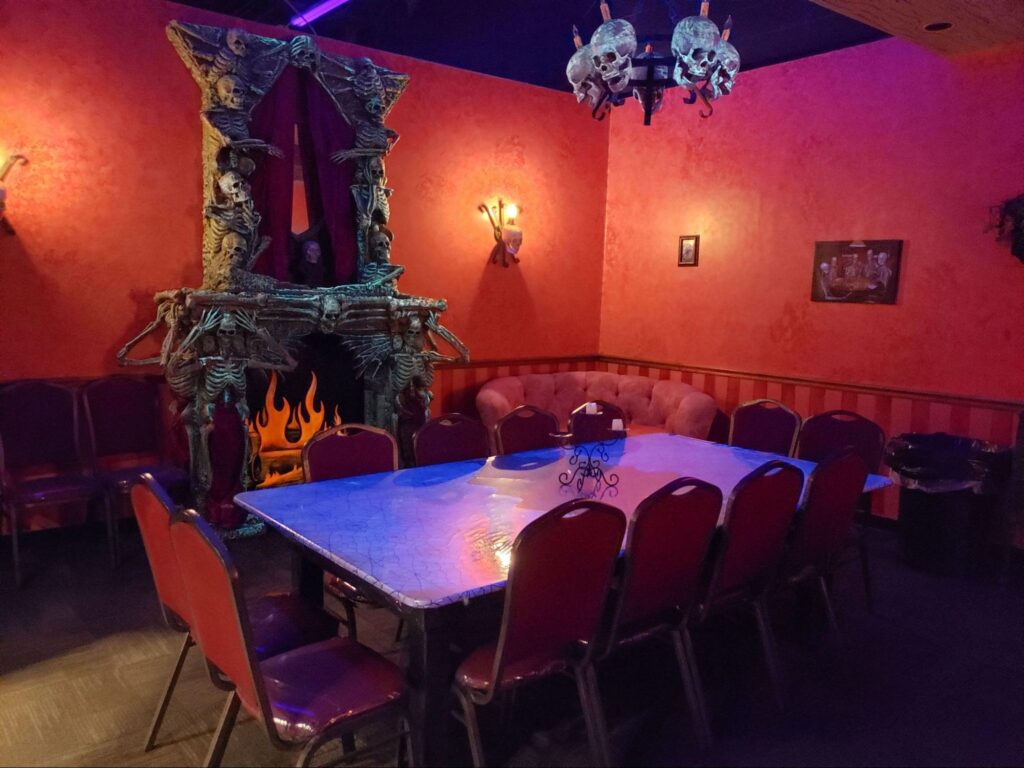 A private haunted mansion room at a monster mini golf location.