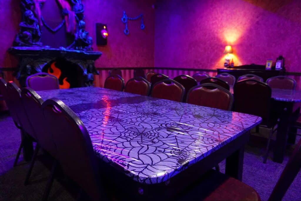 A private Haunted Mansion room decorated for a birthday party at a Monster Mini Golf location.