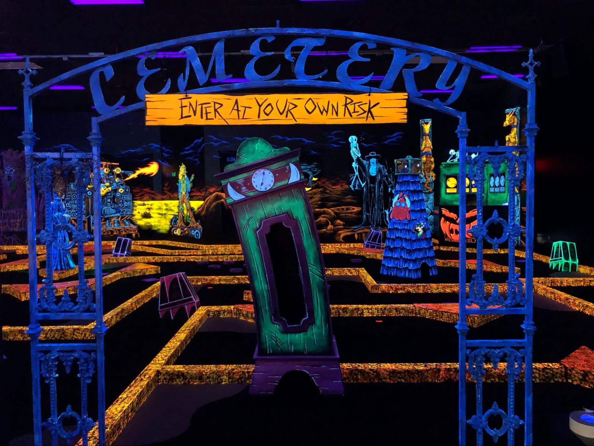 The entrance to a glow-in-the-dark indoor mini golf course at a Monster Mini Golf location. 