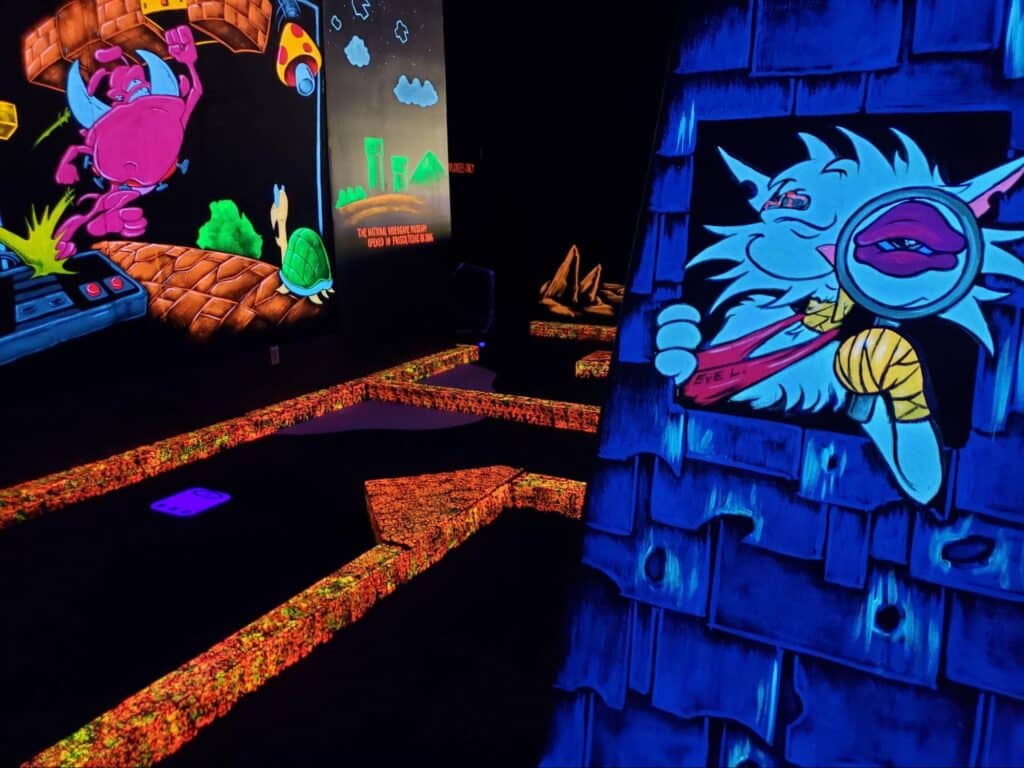 Neon decorations at a Monster Mini Golf indoor golf course location.