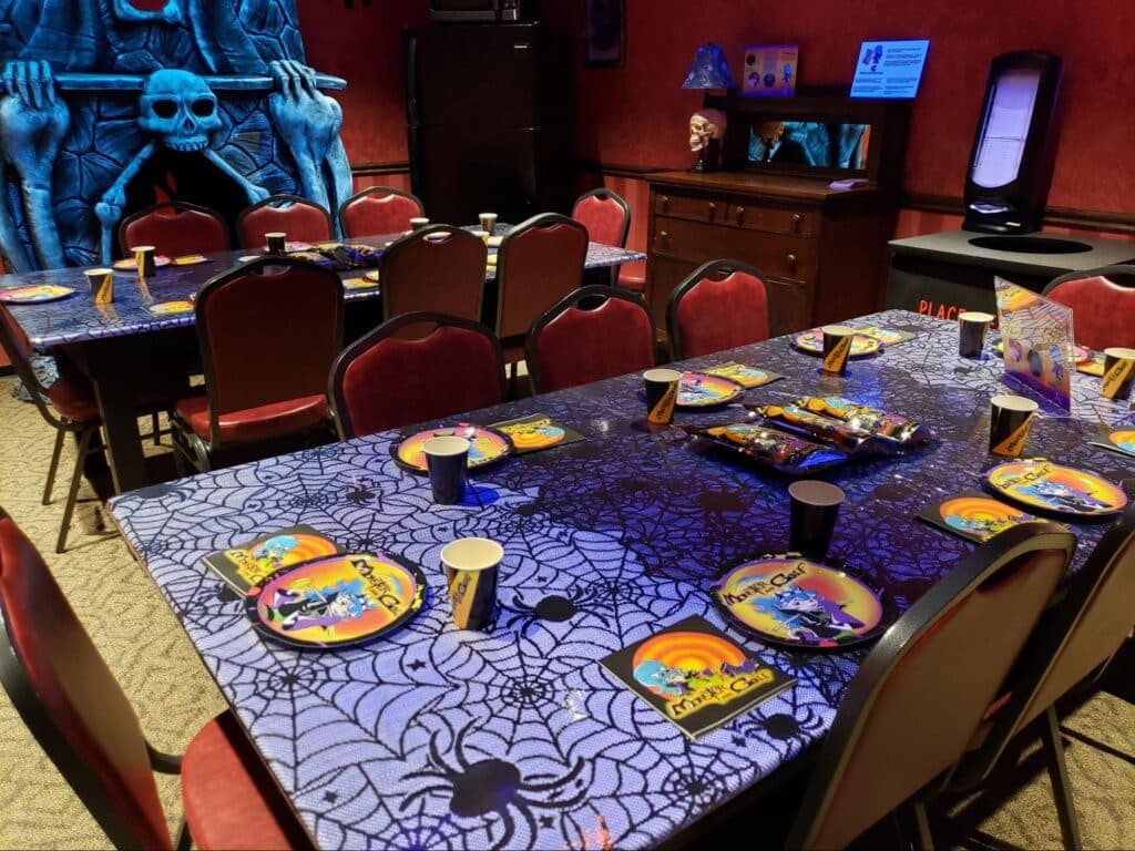 A decorated private Haunted Mansion room at a Monster Mini Golf location.