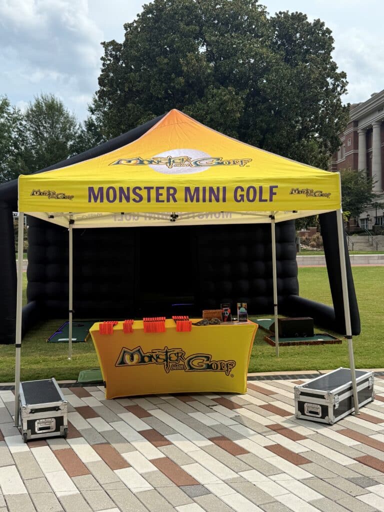 Front ascent game with branded tent and table