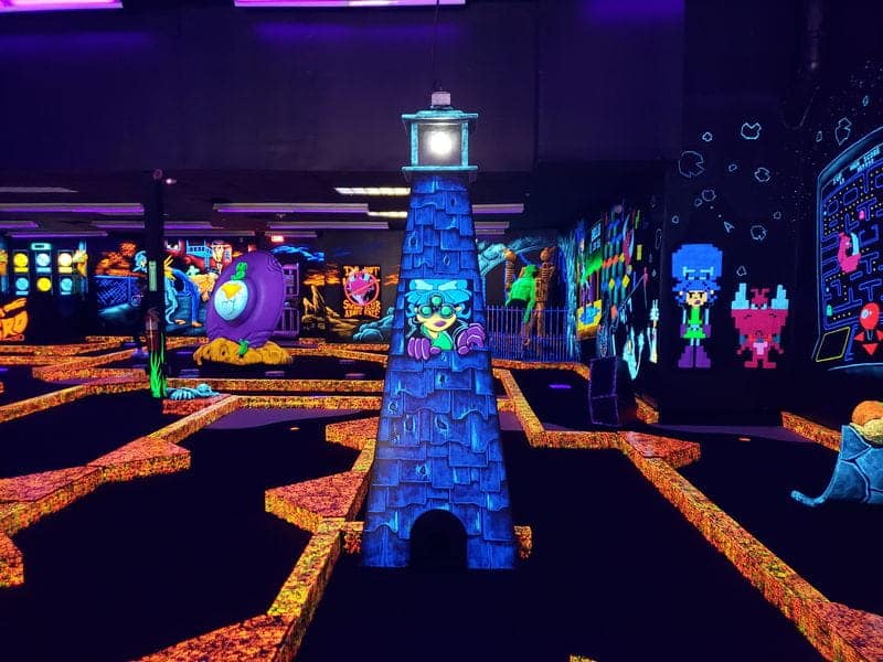 Neon decorations at a monster mini golf location.